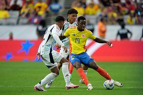 Jhon Jader Duran and Andy Rojas battle for the ball